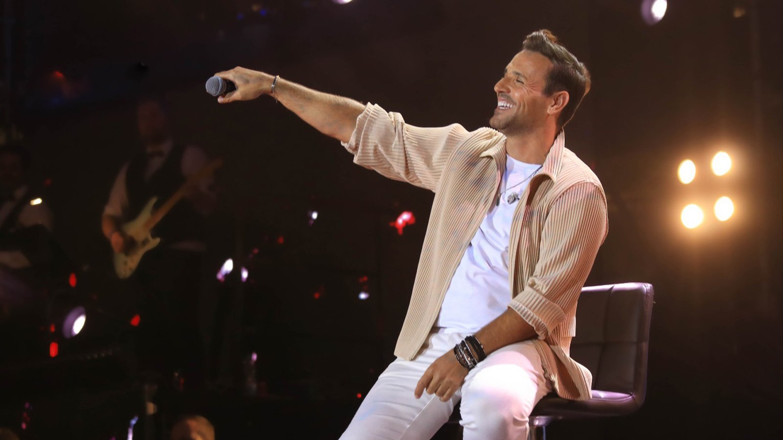 Nikos Vertis performing live at YouTube Theater Los Angeles with large audience and stage lighting